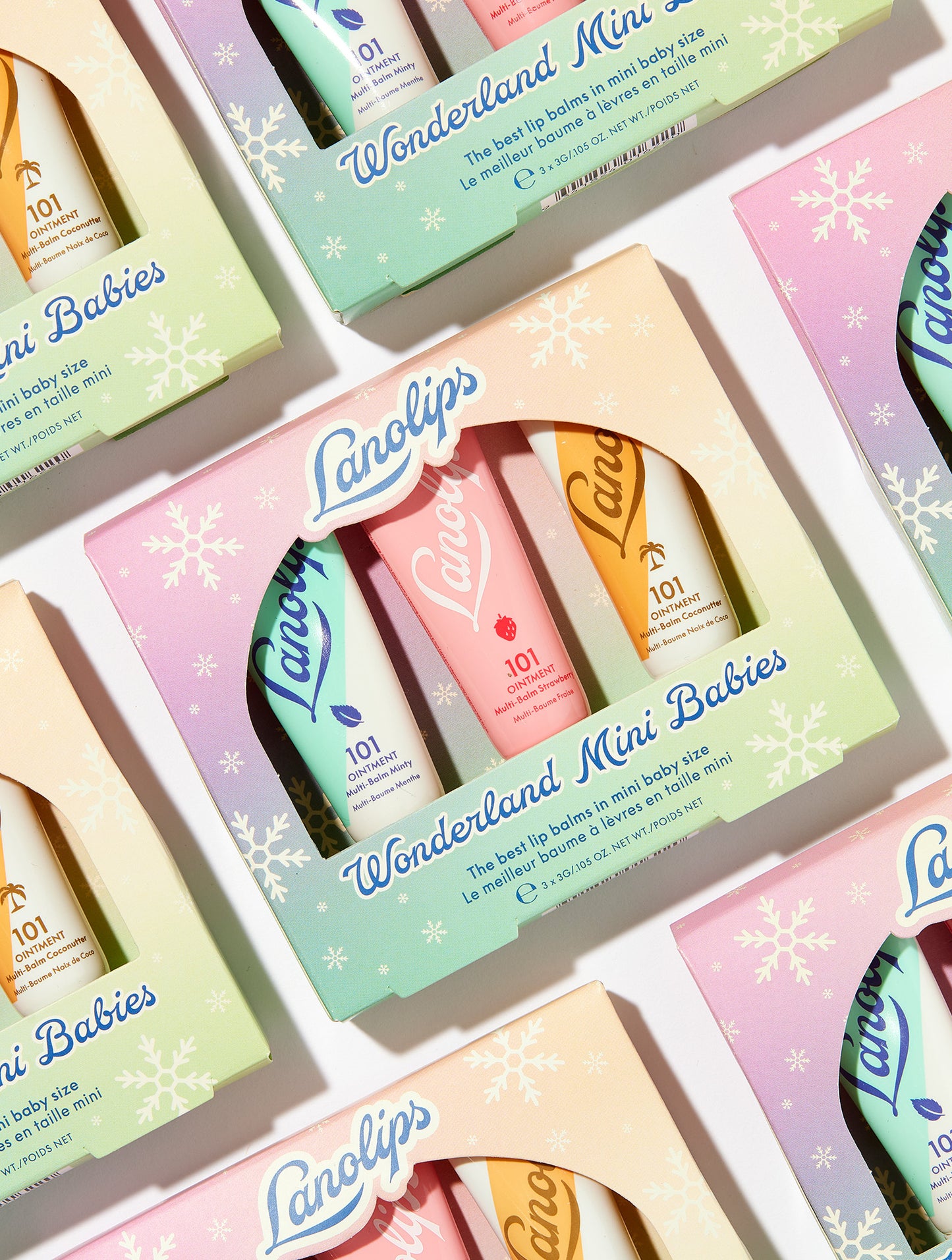 Lanolips Wonderland Mini Babies lip balm set in a decorative box with pastel colors.