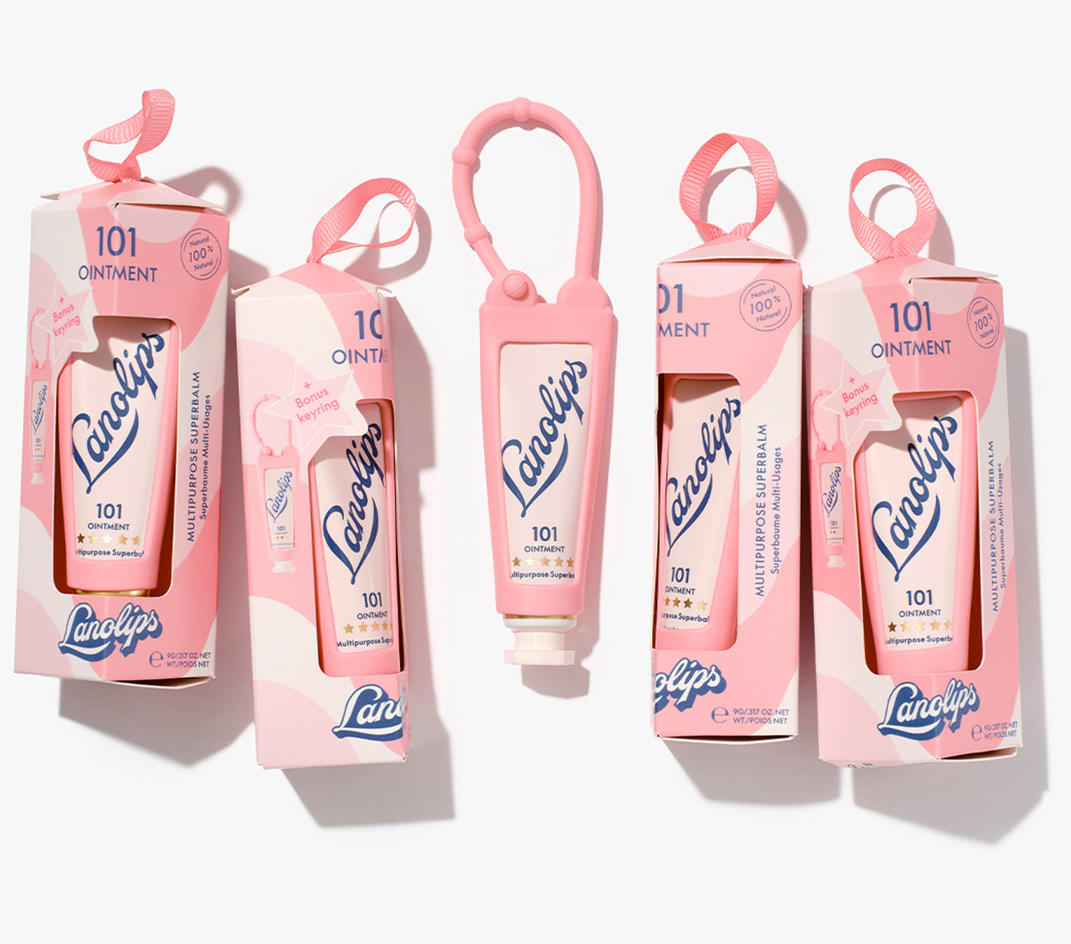 Set of Lanolips Original 101 Ointment 9g Bauble + Key Ring products in packaging laid on a white background. Made with 100% ultra-pure grade lanolin, it's 100% natural with 101 uses.