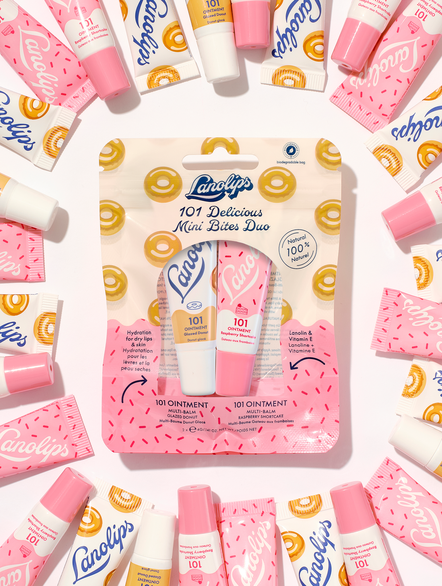 Lifestyle shot of Lanolips 101 Delicious Mini Bites Duo with surrounding mini tubes around it.