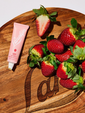 Lanolips 101 Ointment Multi-Balm in Strawberry | Load image into Gallery viewer, Our Lanolips 101 Ointment Multi-Balm in Strawberry has real strawberry fruit extracts. Strawberries are packed with vitamin C, which is known to even out skin tone. We love it&#39;s natural sweetness &amp; good vibes
