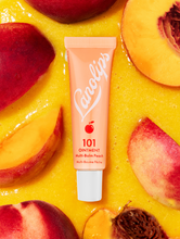Lanolips 101 Ointment Multi-Balm in Peach  | Load image into Gallery viewer, Lanolips 101 Ointment Multi-Balm in Peach is infused with peach kernel oil and vitamin E
