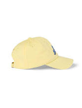 Lanolips Go Bananas Yellow Cap front view. Made with 100% cotton, and the Go Bananas embroidered slogan at the front.  | Load image into Gallery viewer, Lanolips Go Bananas Yellow Cap side view. 
