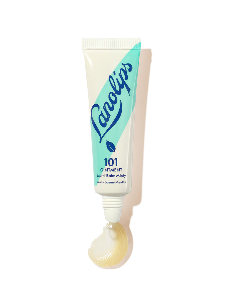 Lanolips 101 Ointment Multi-Balm Minty in a fresh, cool-toned mint green squeezable tube with a white cap. The packaging features the Lanolips logo in deep blue lettering and a small mint leaf icon A dollop of the rich, glossy balm is visible at the opening, showcasing its hydrating texture. Infused with lanolin and peppermint extract, this balm deeply moisturizes and soothes dry lips and skin while delivering a cooling, invigorating minty sensation.
