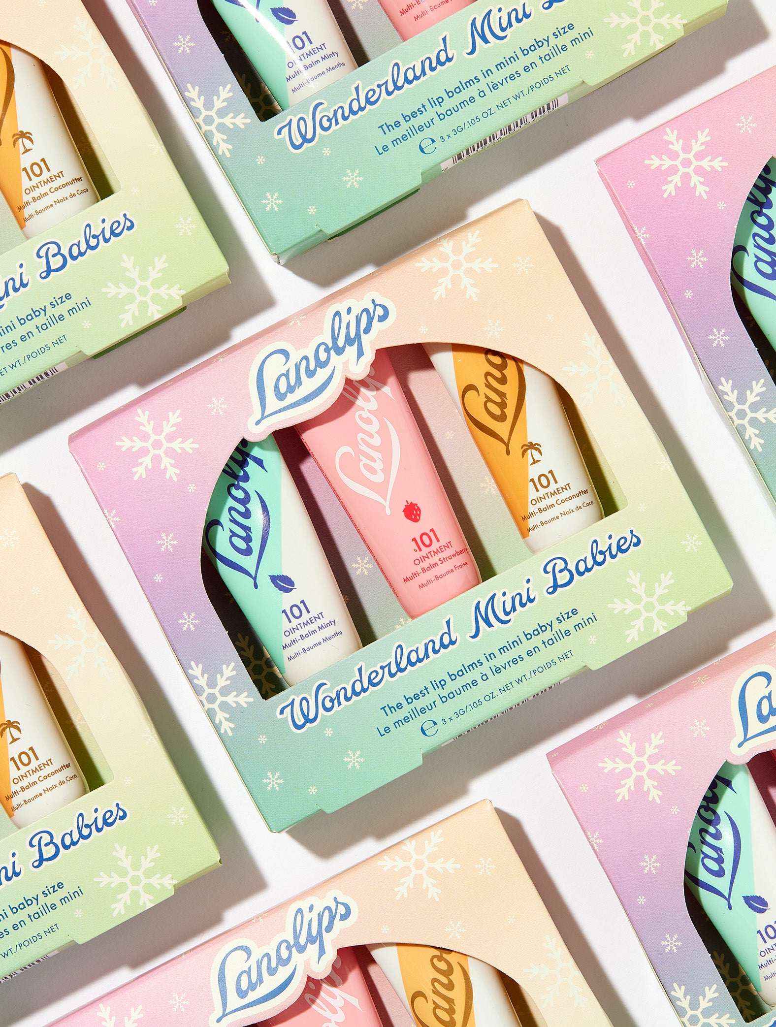 Lanolips Wonderland Mini Babies lip balm set in a decorative box with pastel colors.