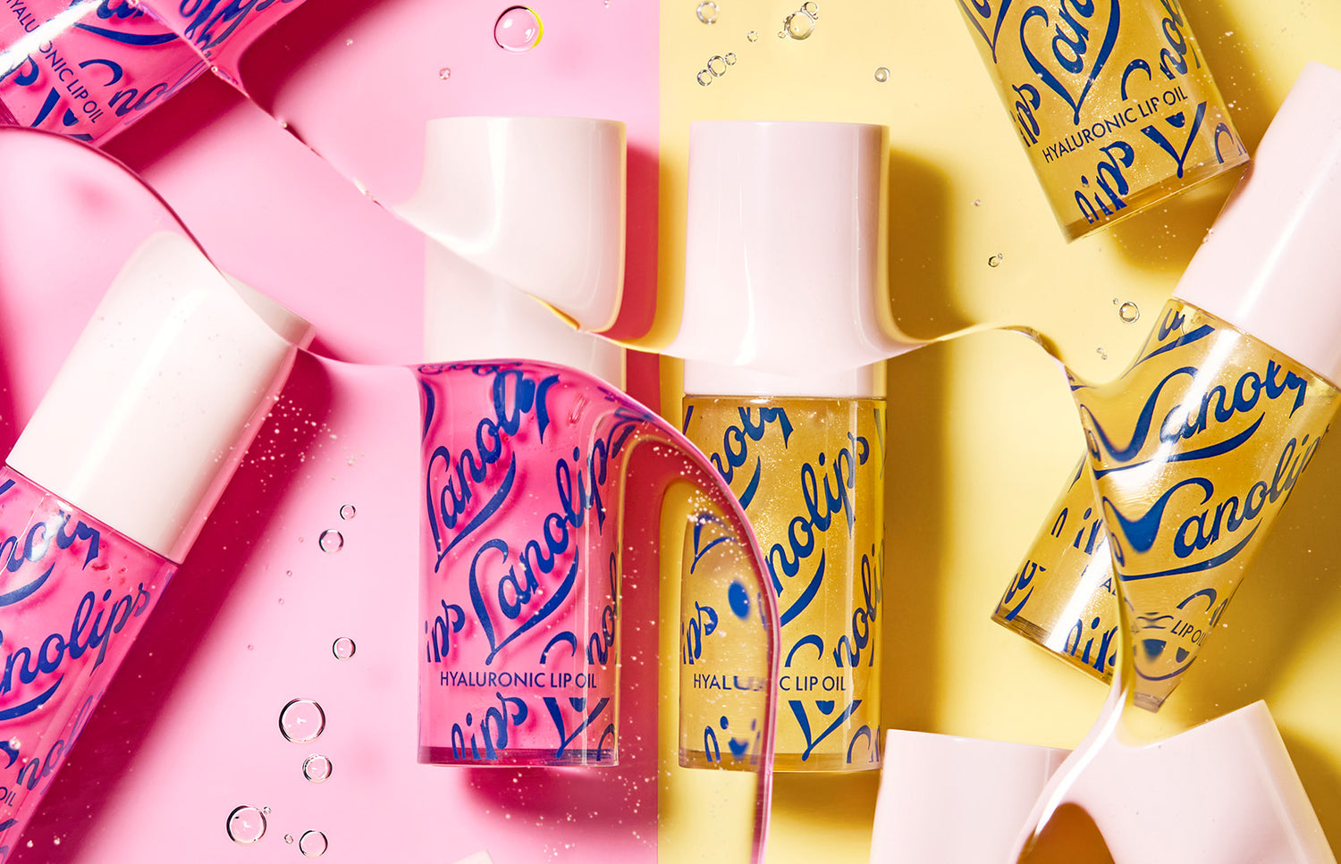 Lanolips hyaluronic lip oil duo in raspberry and honey.