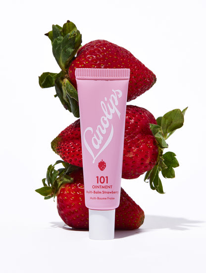 Lanolips 101 ointment strawberry tube with fresh strawberry fruits.