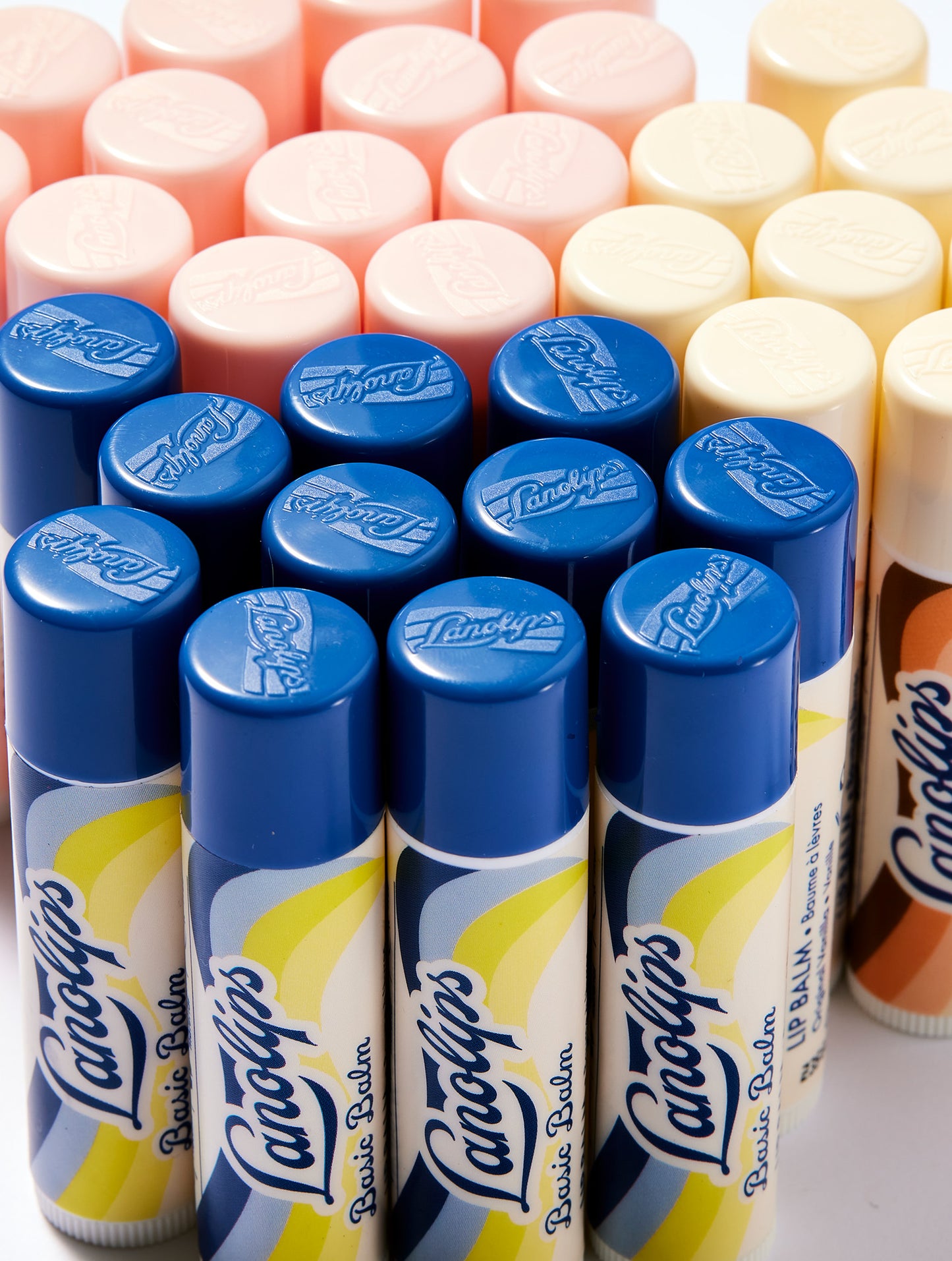 Collection of Lanolips Basic Balms in the natural flavors of Original Vanilla, Coconutter and Strawberry. 
