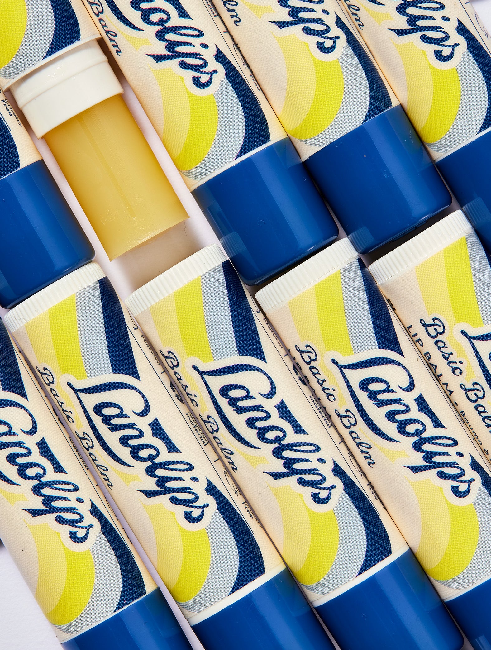Multiple boxes of Lanolips Basic Balm Original Vanilla with blue and yellow design.