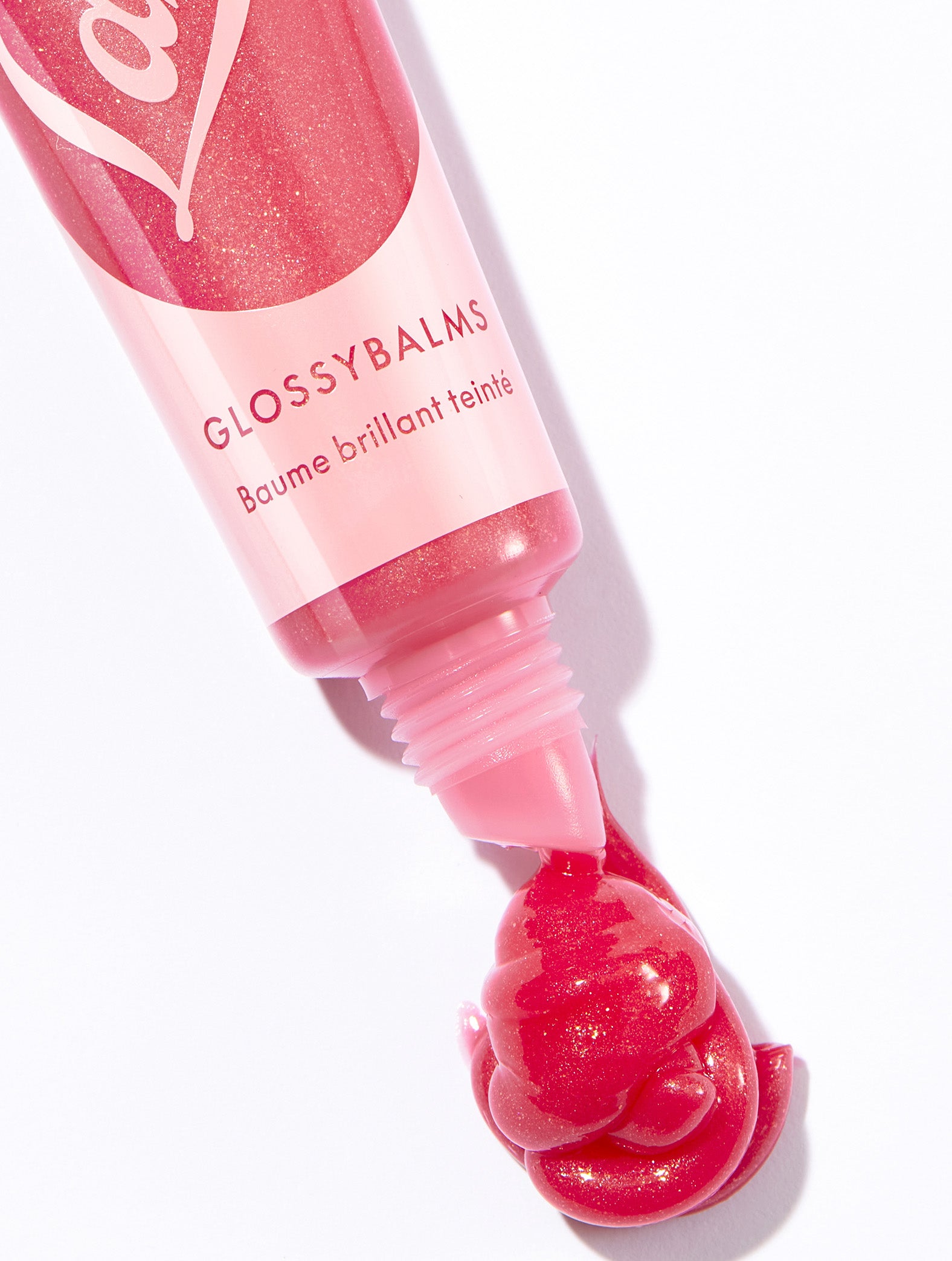 Lanolips glossybalm candy tube with product swatch.