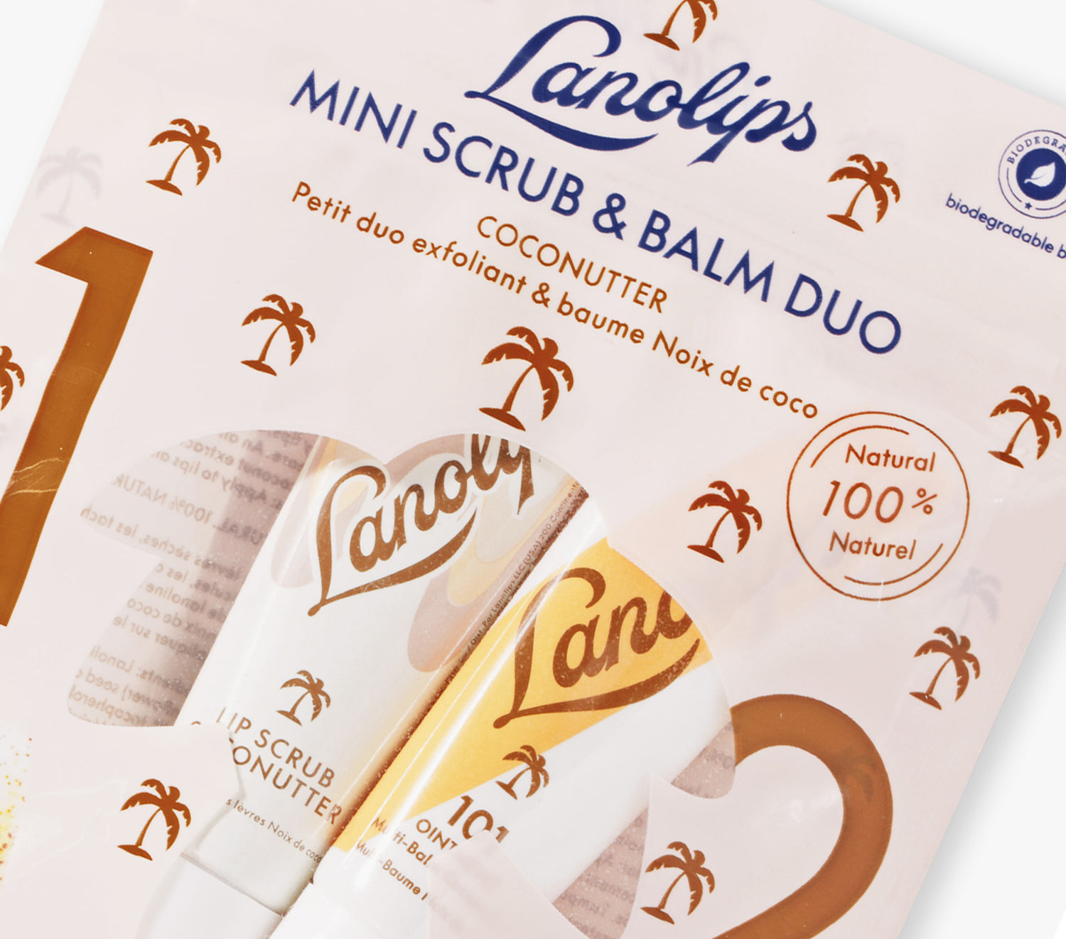 Lifestyle shot of the Lanolips Mini Scrub & Balm Duo in Coconutter. Contains our bestselling 101 Ointment Multi Balm Coconutter and Lip Scrub Coconutter. 