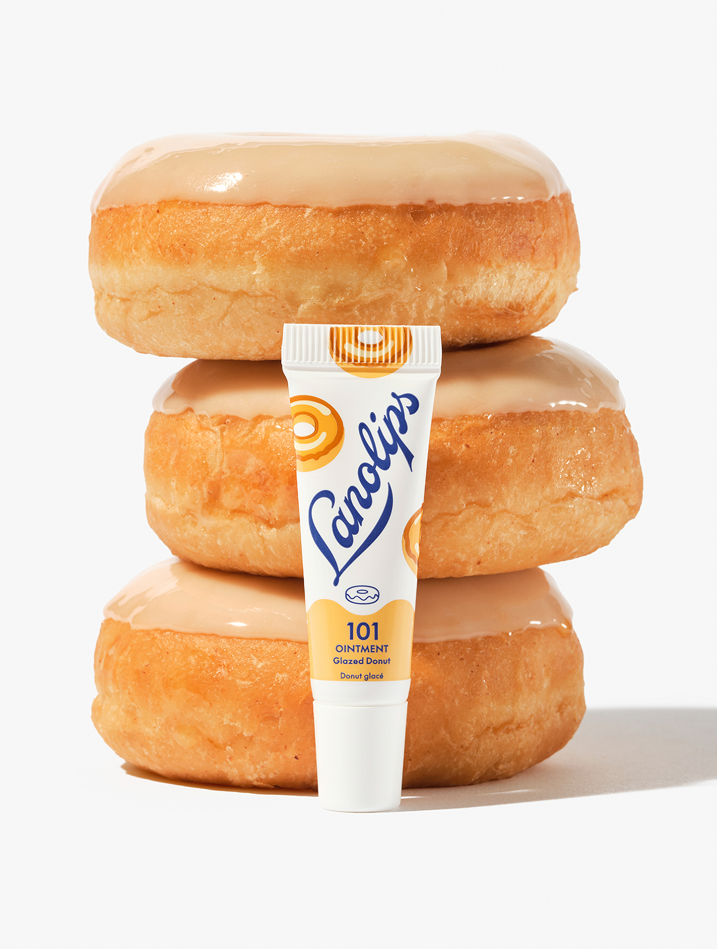 Experience the pure bliss of sinking your teeth into a glazed donut with every swipe with the Lanolips 101 Ointment Multi-Balm Glazed Donut in mini size.