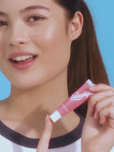 Tinted Lanolin Lip Balm Rhubarb | Load and play video in Gallery viewer, Model applying Lanolips&#39; Tinted Lip Balm in Rhubarb.
