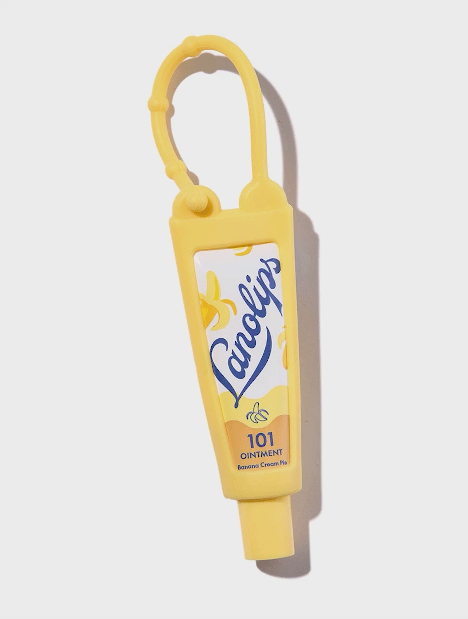 Lanolips Yellow Key Ring. This key ring is refillable with your favorite Lanolips tube in 9g, 10g, or 12.5g sizes (sold separately).