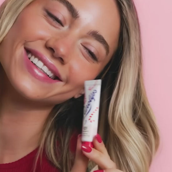 Video of model using the Lanolips 101 Ointment Multi-Balm Candy Cane, a limited edition festive gourmand flavor. 