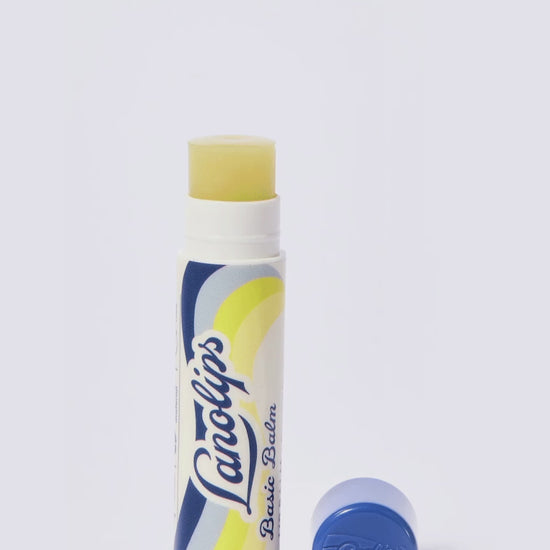 Video of Lanolips Basic Balm Original Vanilla in motion. Product set against a white background.