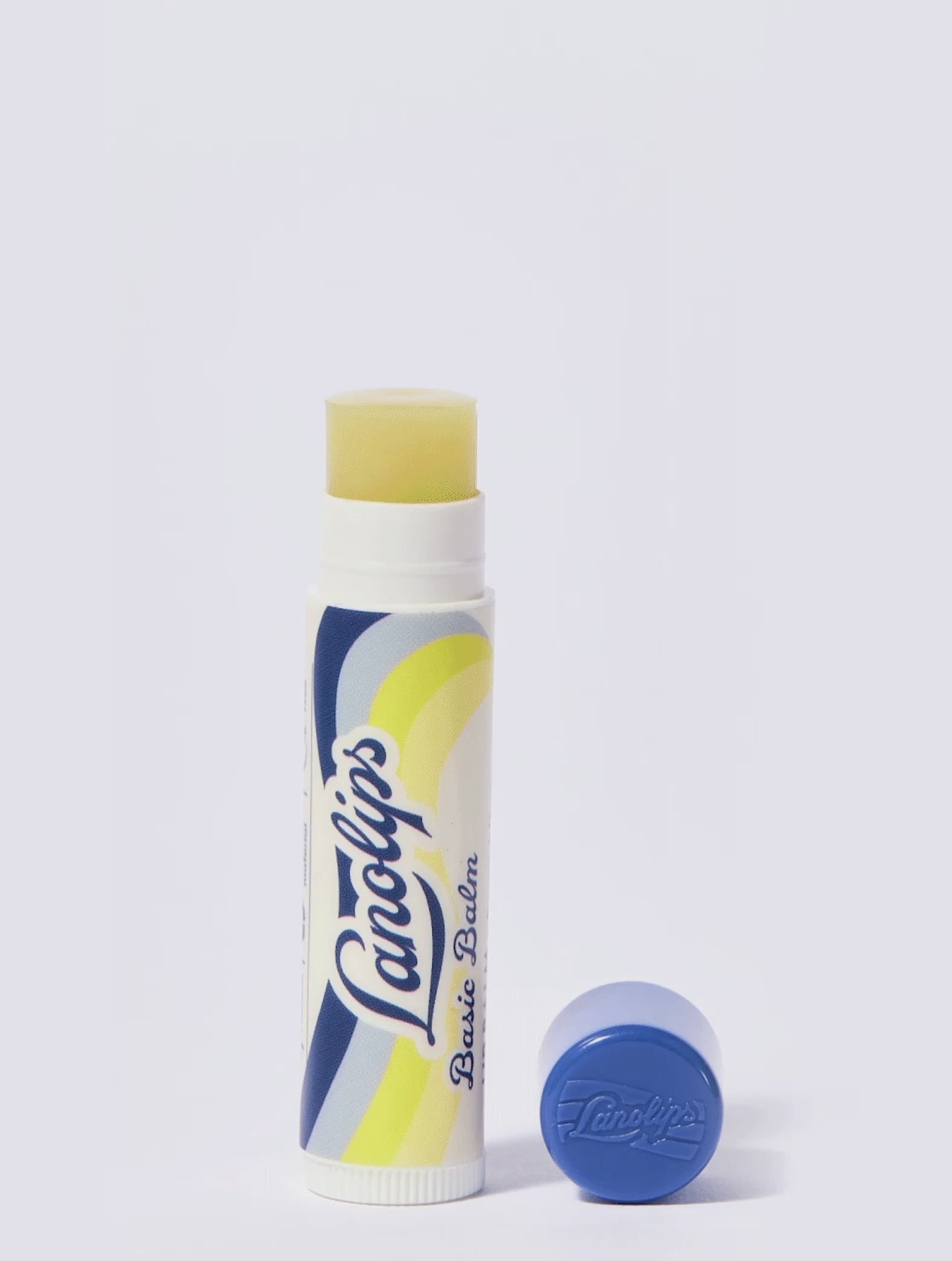 Video of Lanolips Basic Balm Original Vanilla in motion. Product set against a white background.