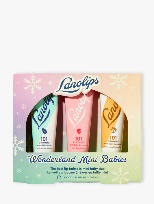 Product shot of the Lanolips Wonderland Mini Babies - the best lip balms now in baby sized form. The trio includes minty, strawberry and coconutter. 