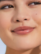 Tinted Lanolin Lip Balm Perfect Nude | Load image into Gallery viewer, Model with Tinted Lip Balm in Perfect Nude SPF30 is anchored by the high lanolin content, drenching the lips in non-sticky hydration which lasts for hours with the perfect nude tint which suits everyone.
