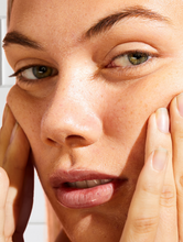 lanolin face base day cream	 | Load image into Gallery viewer, Model applying Face Base Vitamin-E Day Cream onto face
