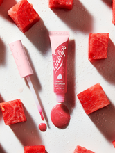 Lanolips Lip Water Watermelon | Load image into Gallery viewer, Lip Water Watermelon is a transparent watermelon-pink holographic shimmer - for watermelon juice-tasting lips that are both hydrated and glowing.
