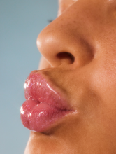 Lanolips Liquid Lip Water | Load image into Gallery viewer, Close up shot of model wearing Lanolips Liquid Lip Water
