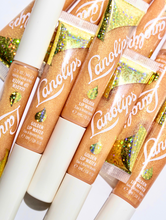 Lanolips Lip Water Liquid Gold | Load image into Gallery viewer, Lanolips Lip Water Liquid Gold has a hint of peppermint oil to refresh. The splash of sparkle adds instant twinkle &amp; light. Wear alone or layer it on top of your lipstick or liner.
