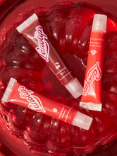 Fruity Jellybalm Cherry: Our 101 Ointment now has added cherry fruity extracts. | Load image into Gallery viewer, Lanolips Fruity Jellybalms are soft, bouncy and shiny. It is a tinted lip balm that works like a lip stain, but drenched in the intense Lanolips hydration you know and love. 
