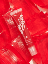 Fruity Jellybalm in Strawberry is a transparent light red tint. | Load image into Gallery viewer, Fruity Jellybalm in Strawberry has a light transparent red tint.
